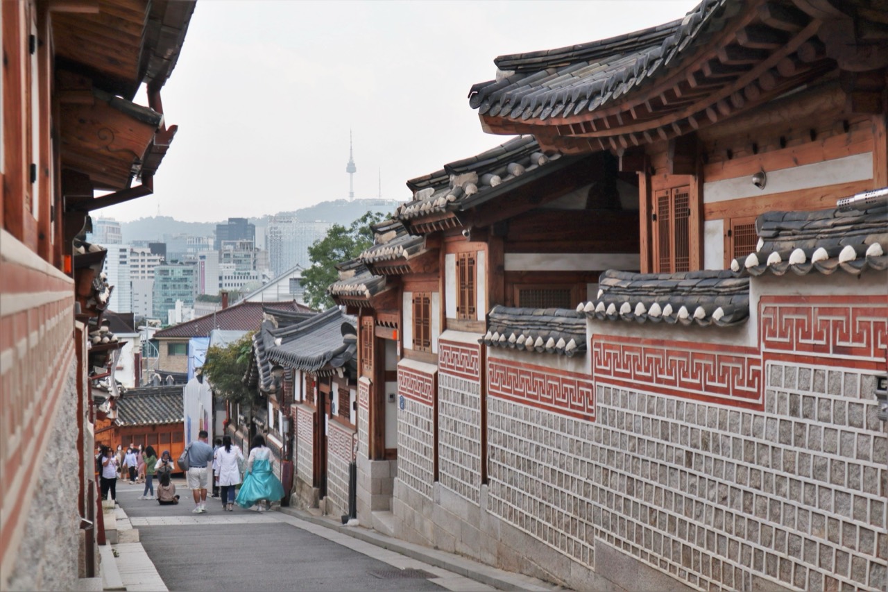 Traditional hanok homes lining a narrow street in Bukchon Hanok Village, Seoul