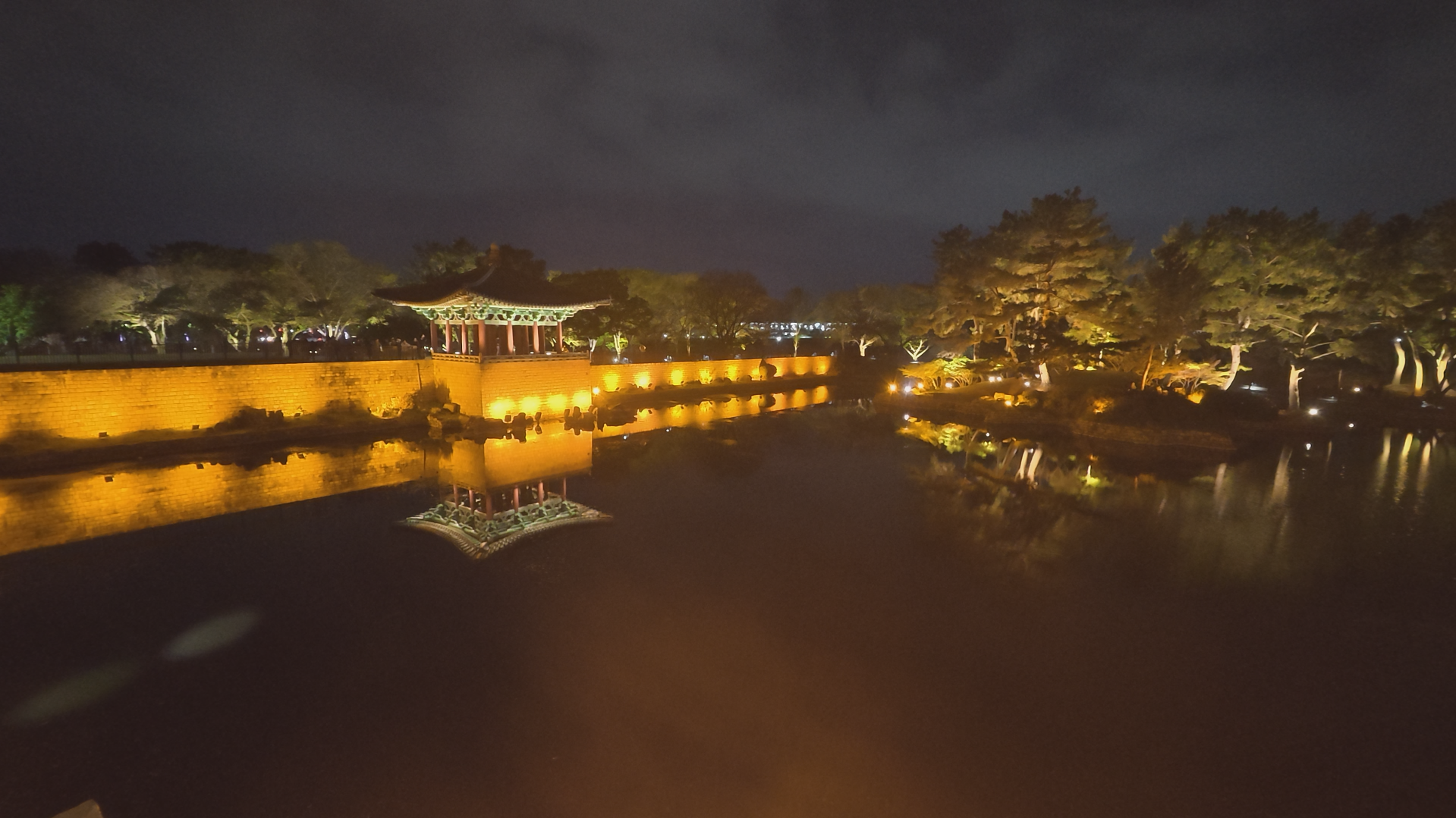 Donggung Palace and Wolji Pond illuminated at night with reflections on the water in Gyeongju