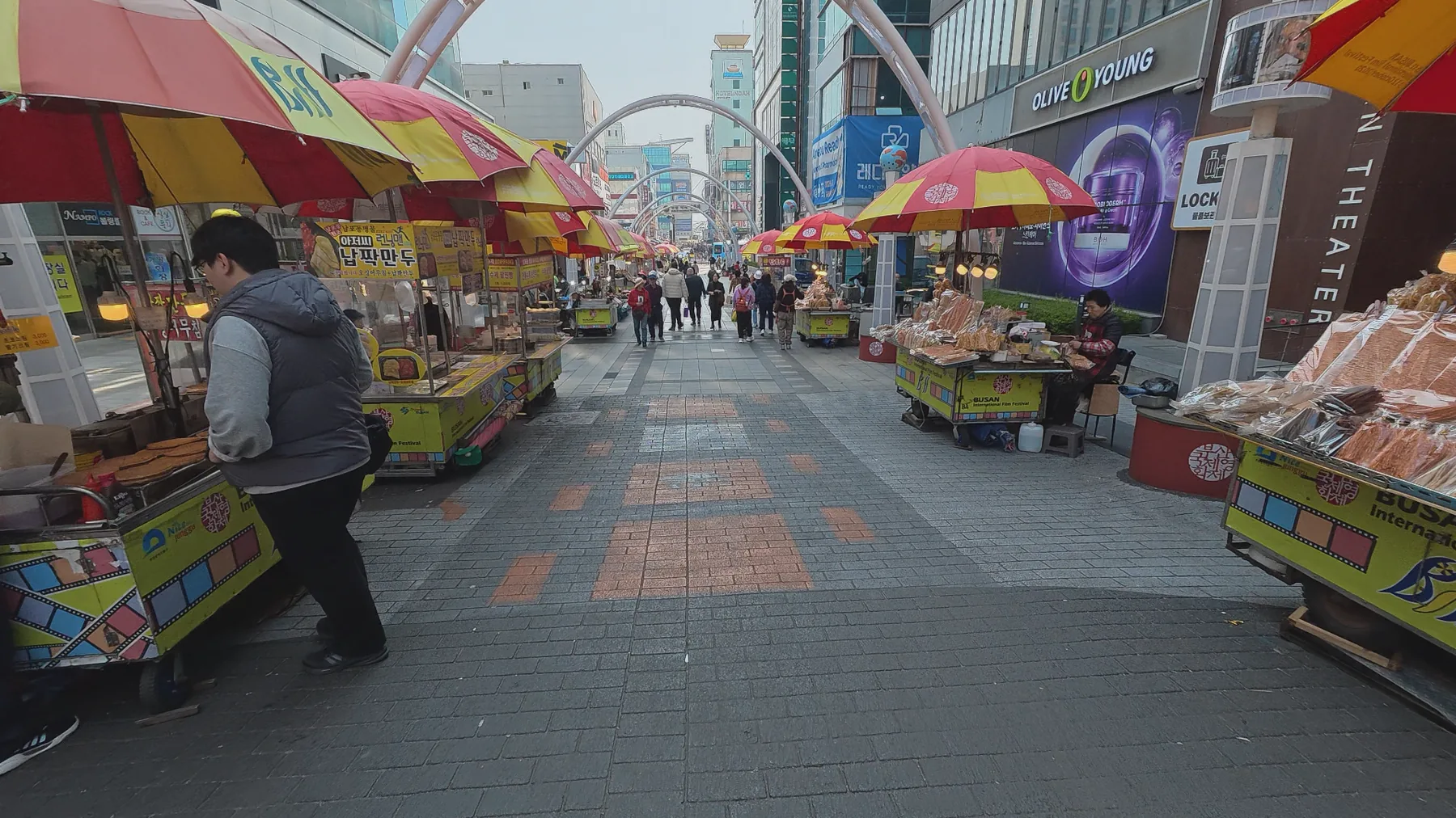 Street food stalls along a busy Nampo-dong shopping street in Busan