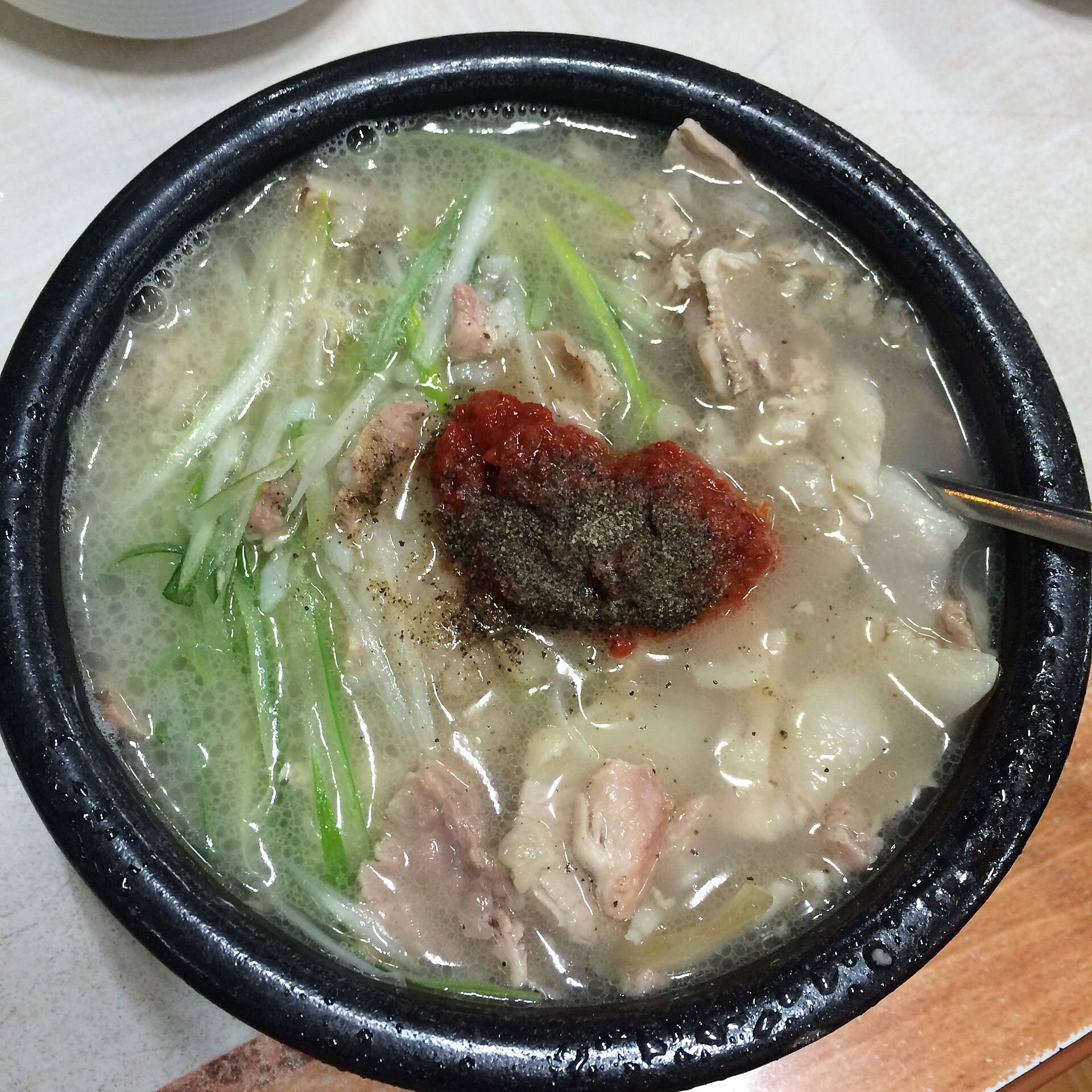 Dwaeji gukbap pork rice soup with red spicy seasoning