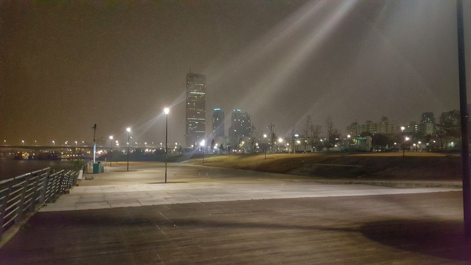 63 Building and Yeouido Hangang Park illuminated beside the Han River at night
