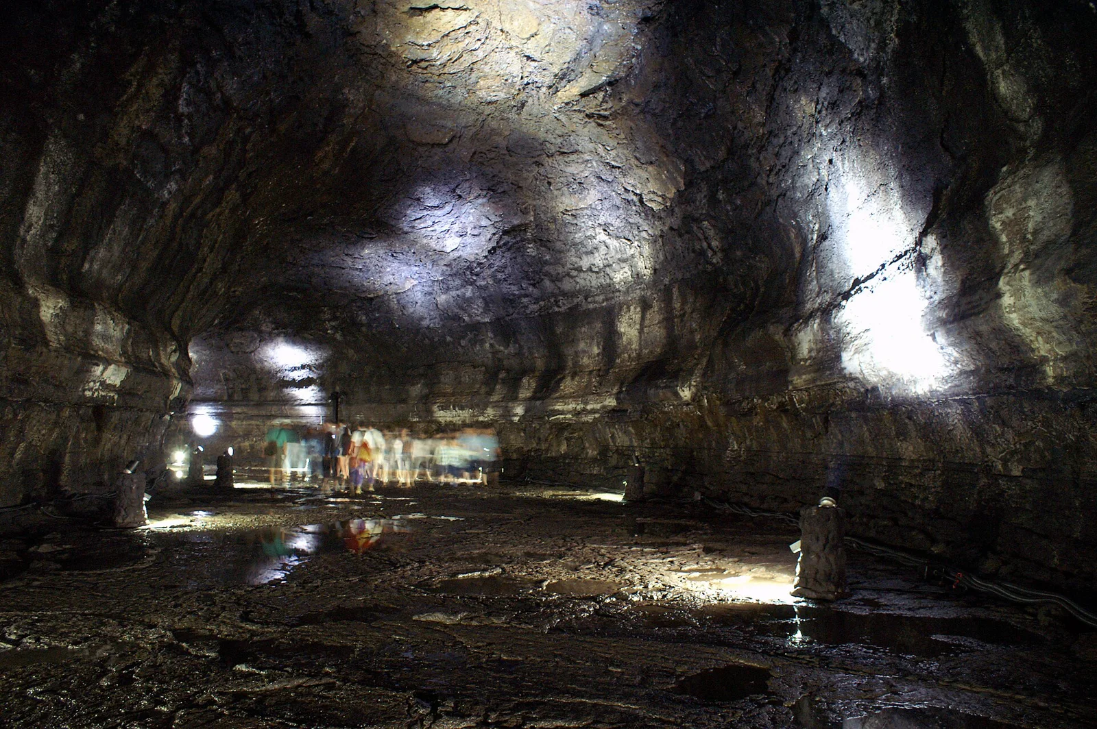Illuminated rock walls inside Manjanggul Lava Tube on Jeju Island
