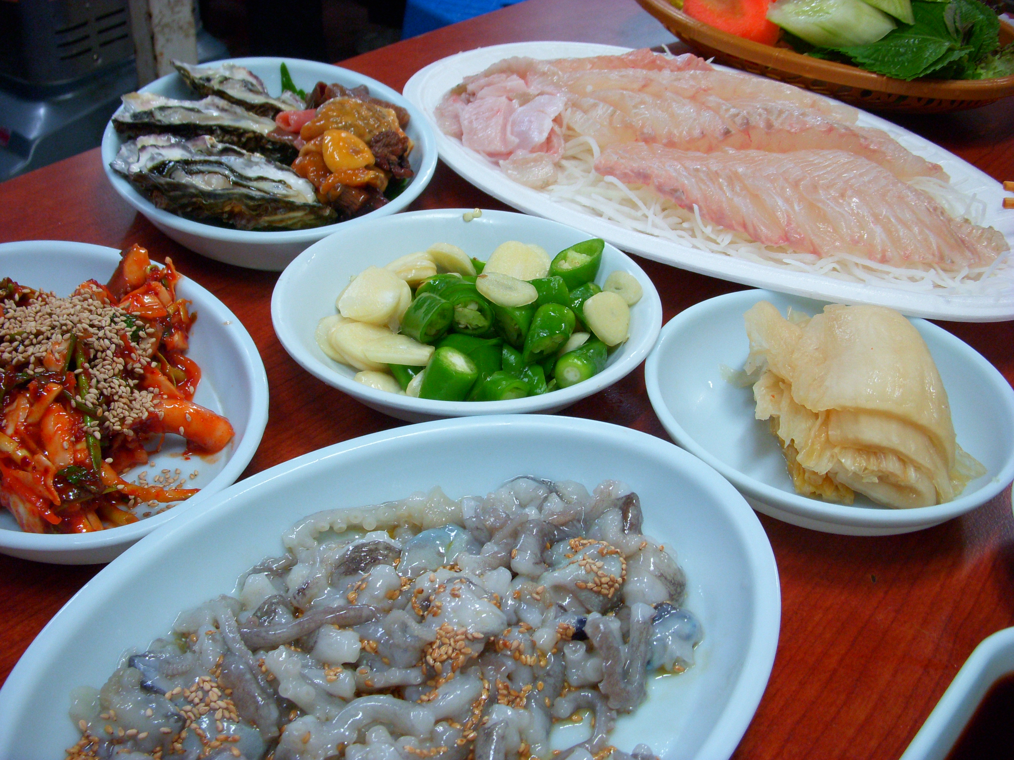 Korean hoe raw seafood served on plates