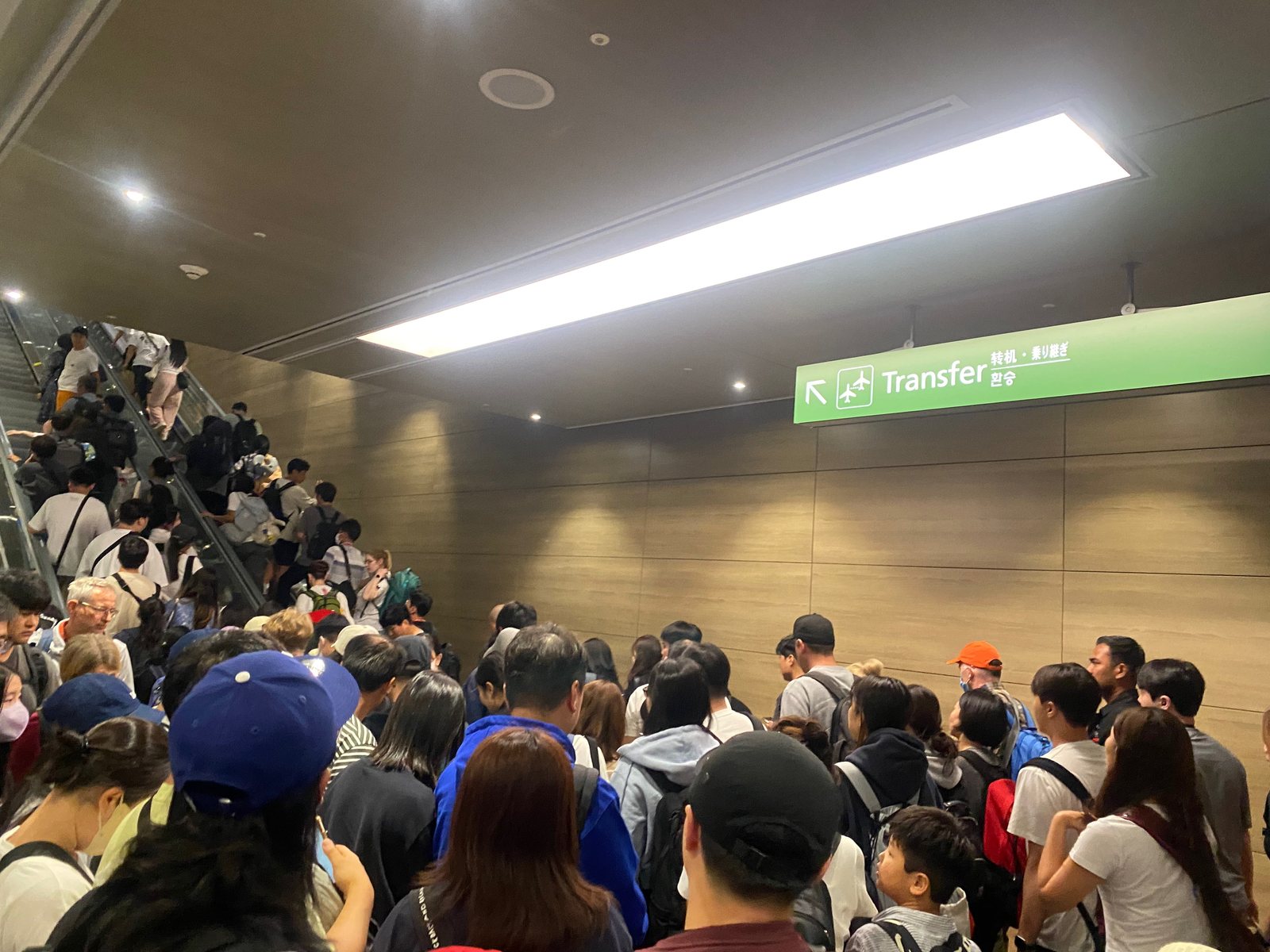 Travelers queueing in an arrivals area at Incheon Airport