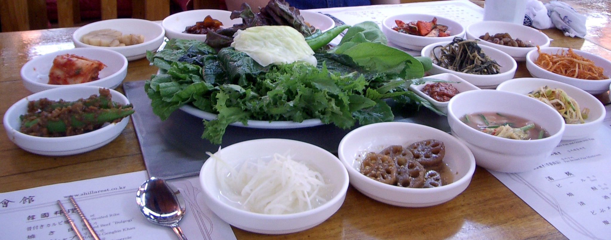 Ssambap with leafy vegetables and side dishes in Gyeongju, photographed in 2005; a meal example, not a current restaurant menu.