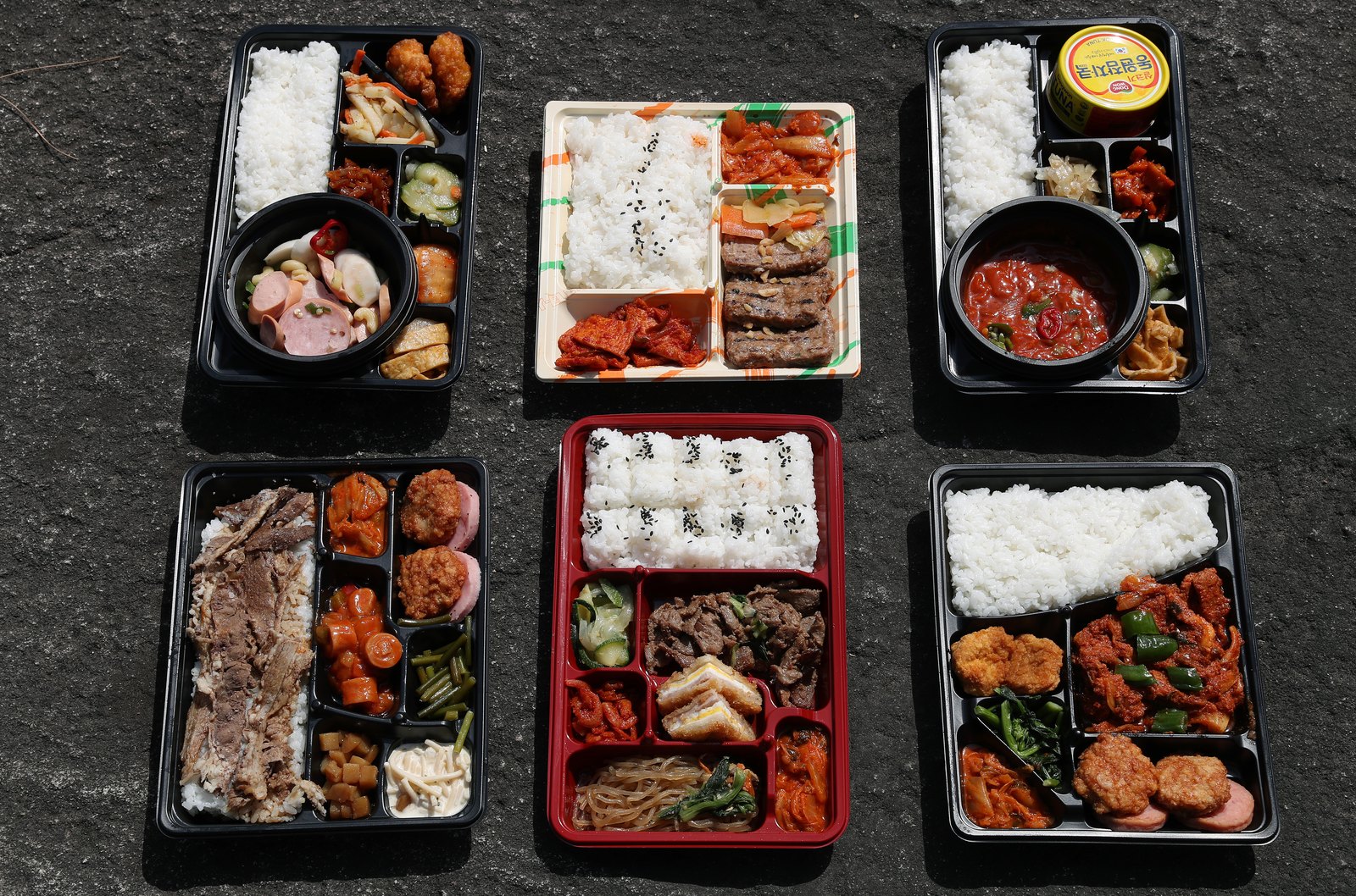 Korean convenience store lunch box with rice and side dishes