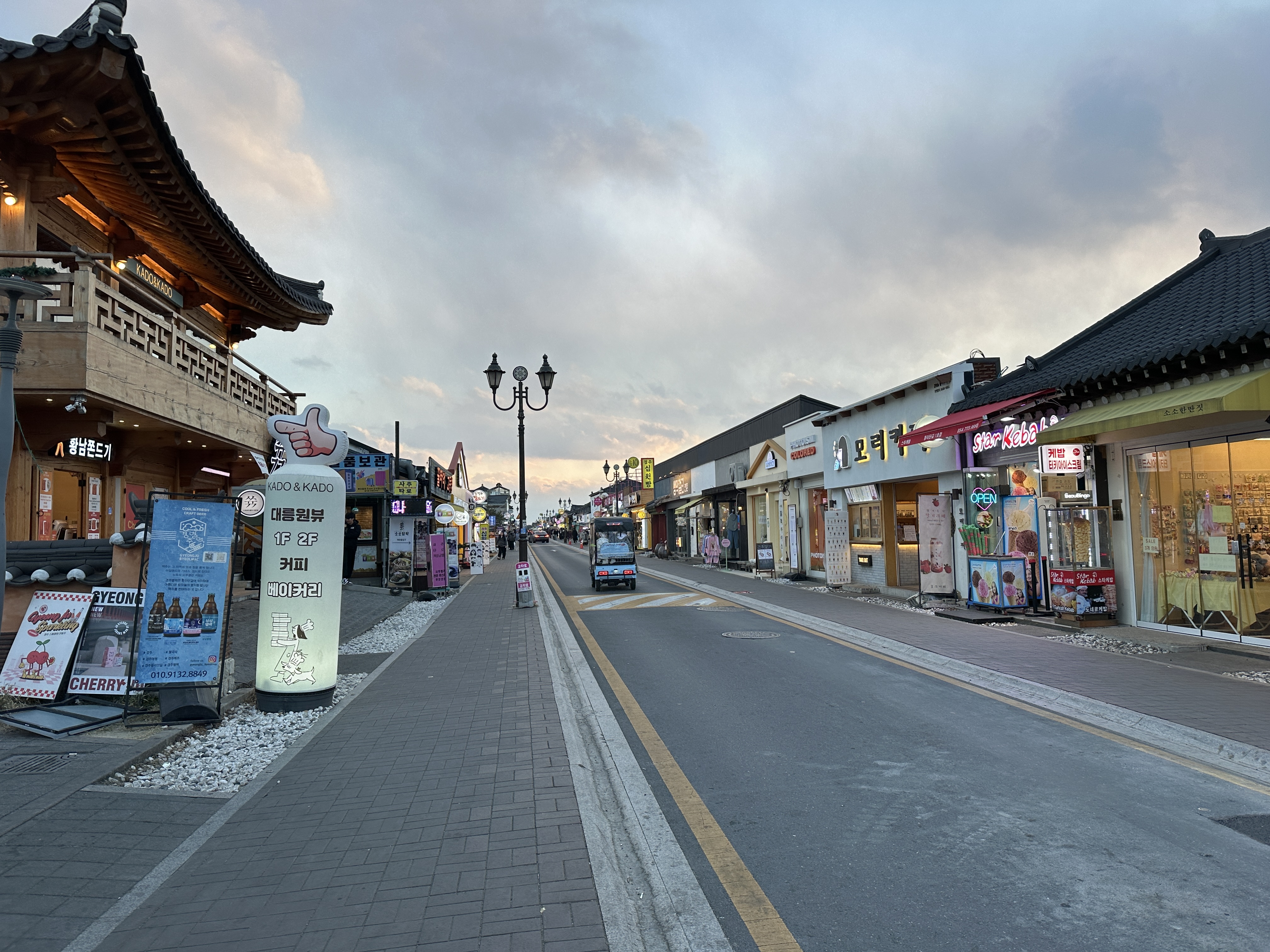 Shops, sidewalks and the roadway on Hwangnidan-gil in Gyeongju.