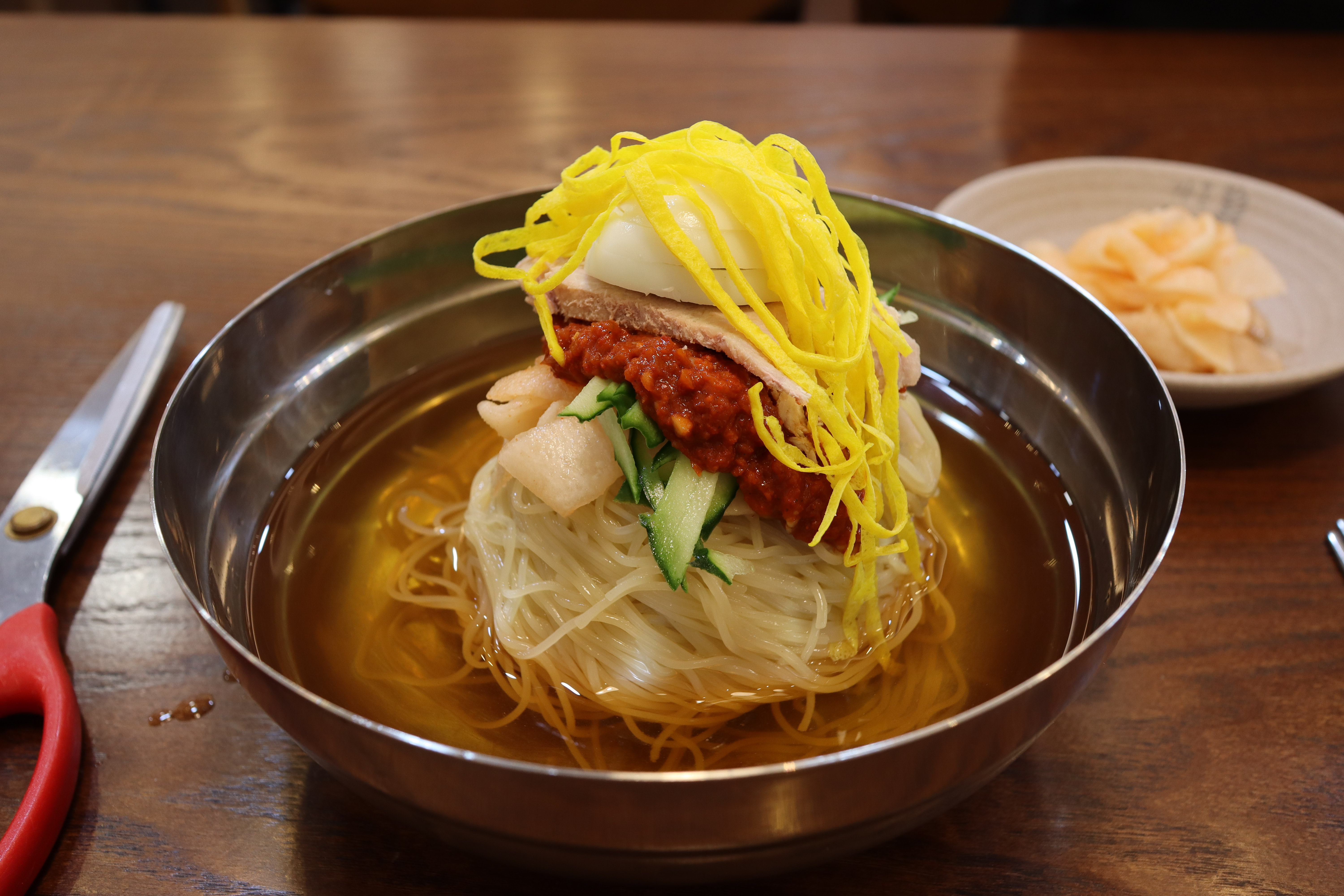 Busan-style milmyeon cold wheat noodles in a bowl