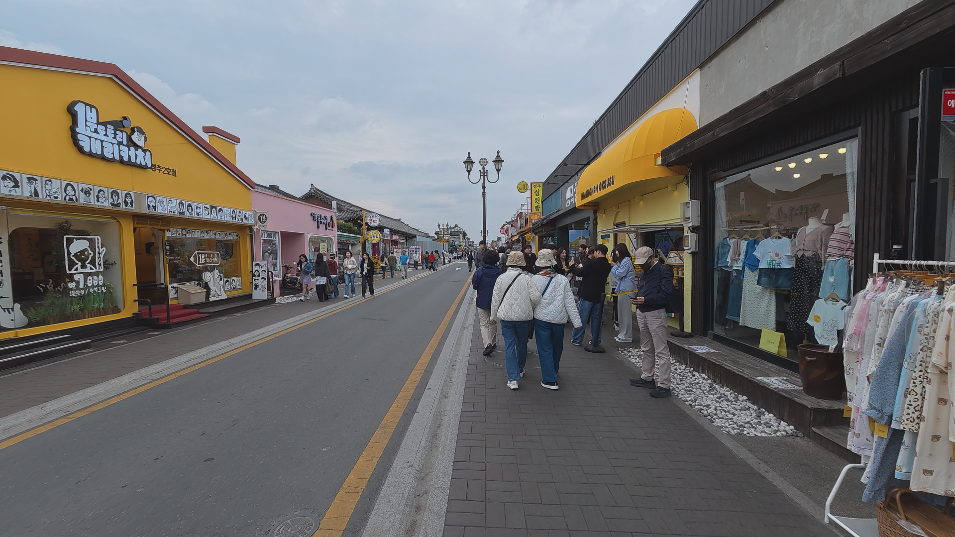 Hwangnidan-gil street with cafes, snack shops, and visitors in Gyeongju