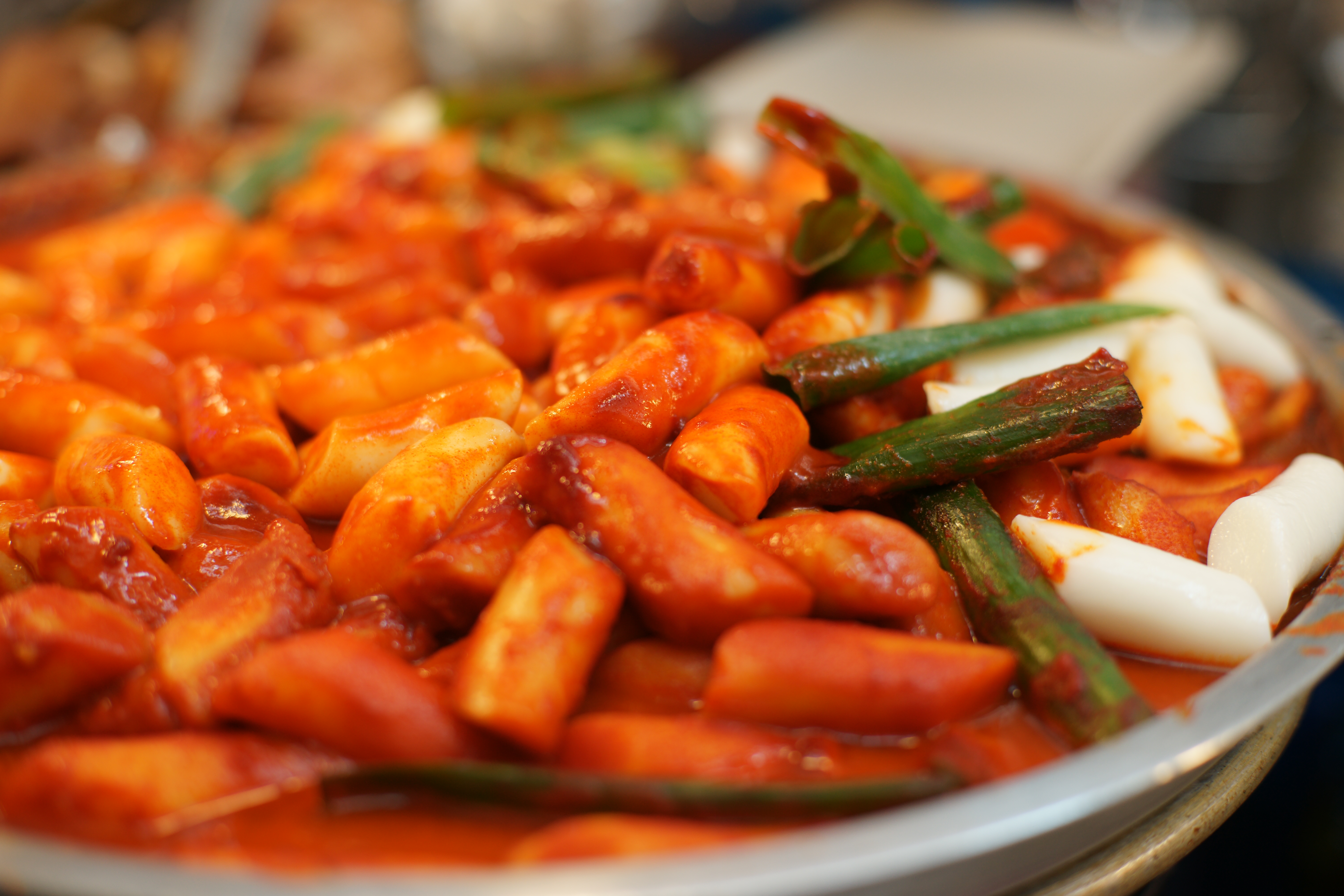 Red tteokbokki rice cakes in spicy sauce
