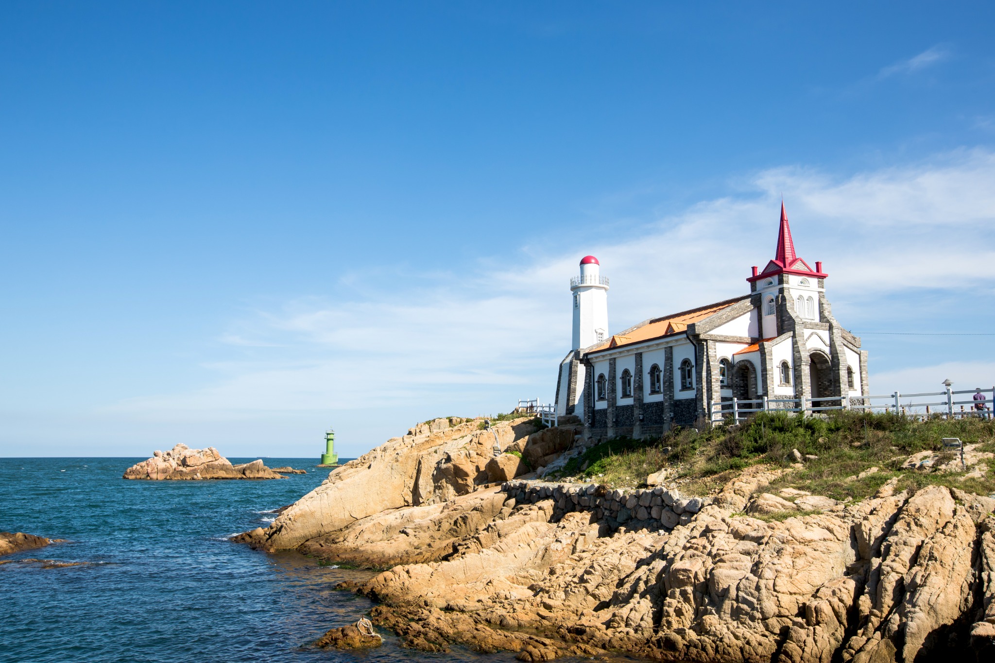 Jukseong filming set with a red spire beside the sea