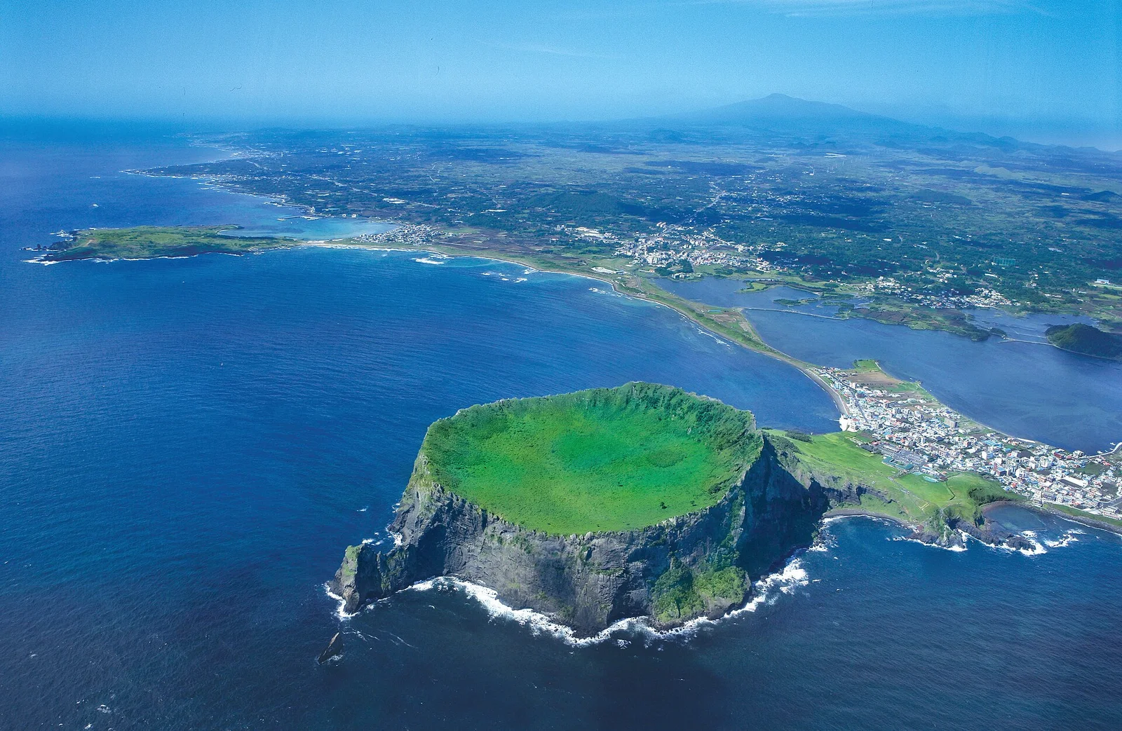 Aerial view of Seongsan Ilchulbong volcanic crater beside the coast on Jeju Island