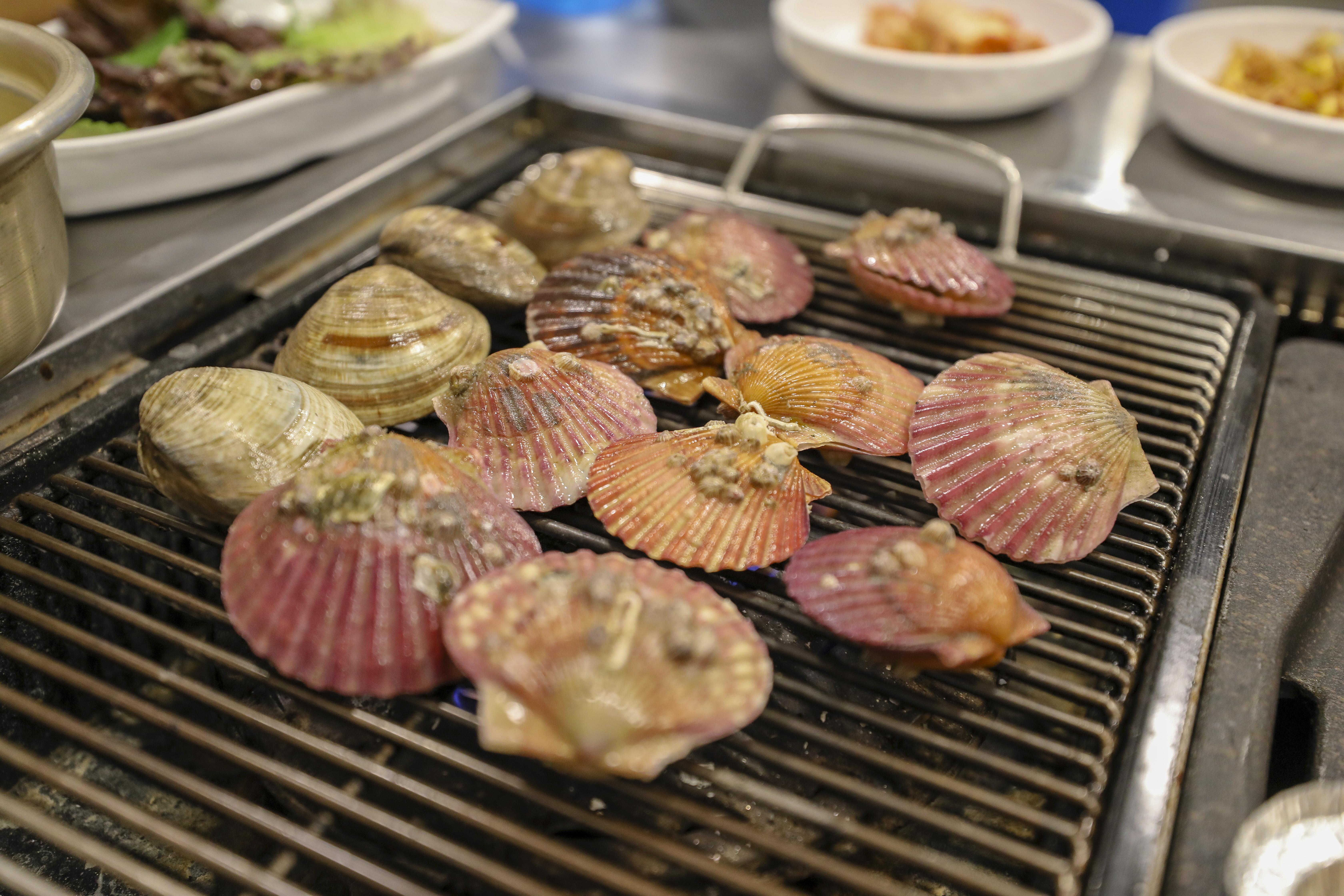 Grilled clams served Korean style